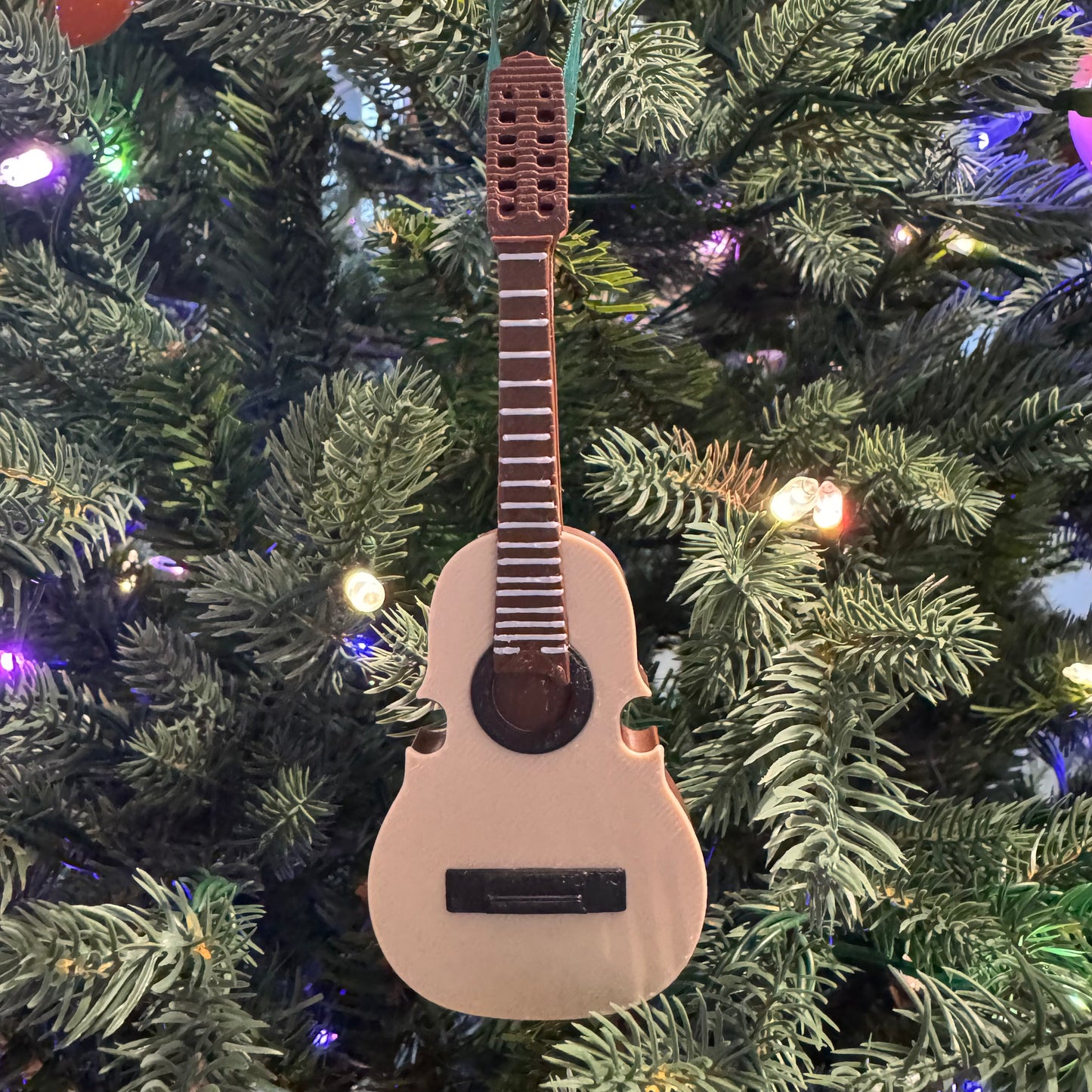 Cuatro Ornamento Navideño